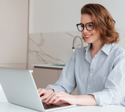 Person typing in a laptop